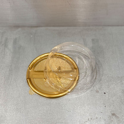 Close up of Marah Design plastic round cake container  with lid and gold tray